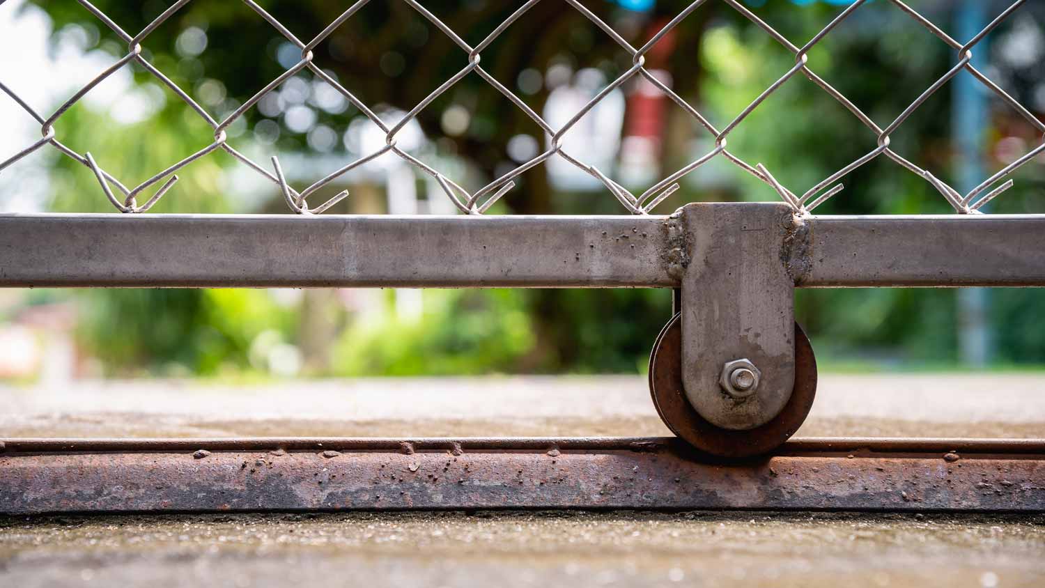 wheels of chain link fence