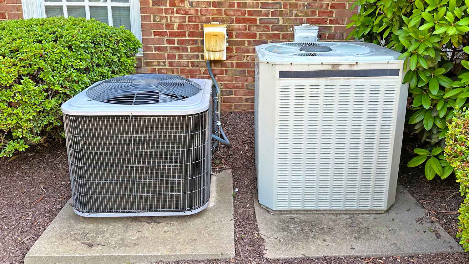 Air conditioner units sitting in the yard