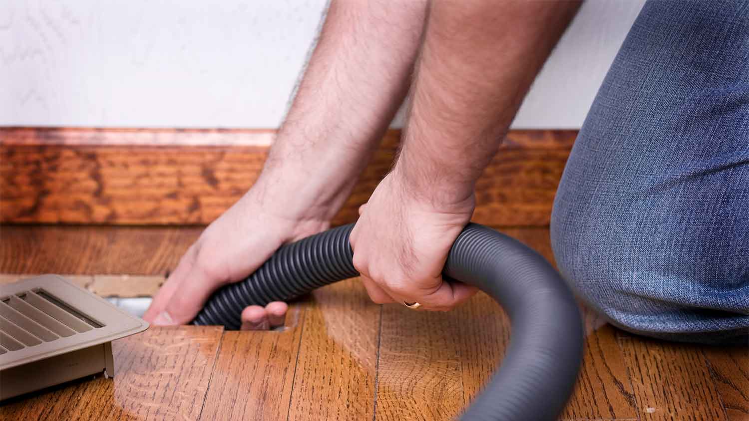 Professional air duct cleaning service cleaning floor vent