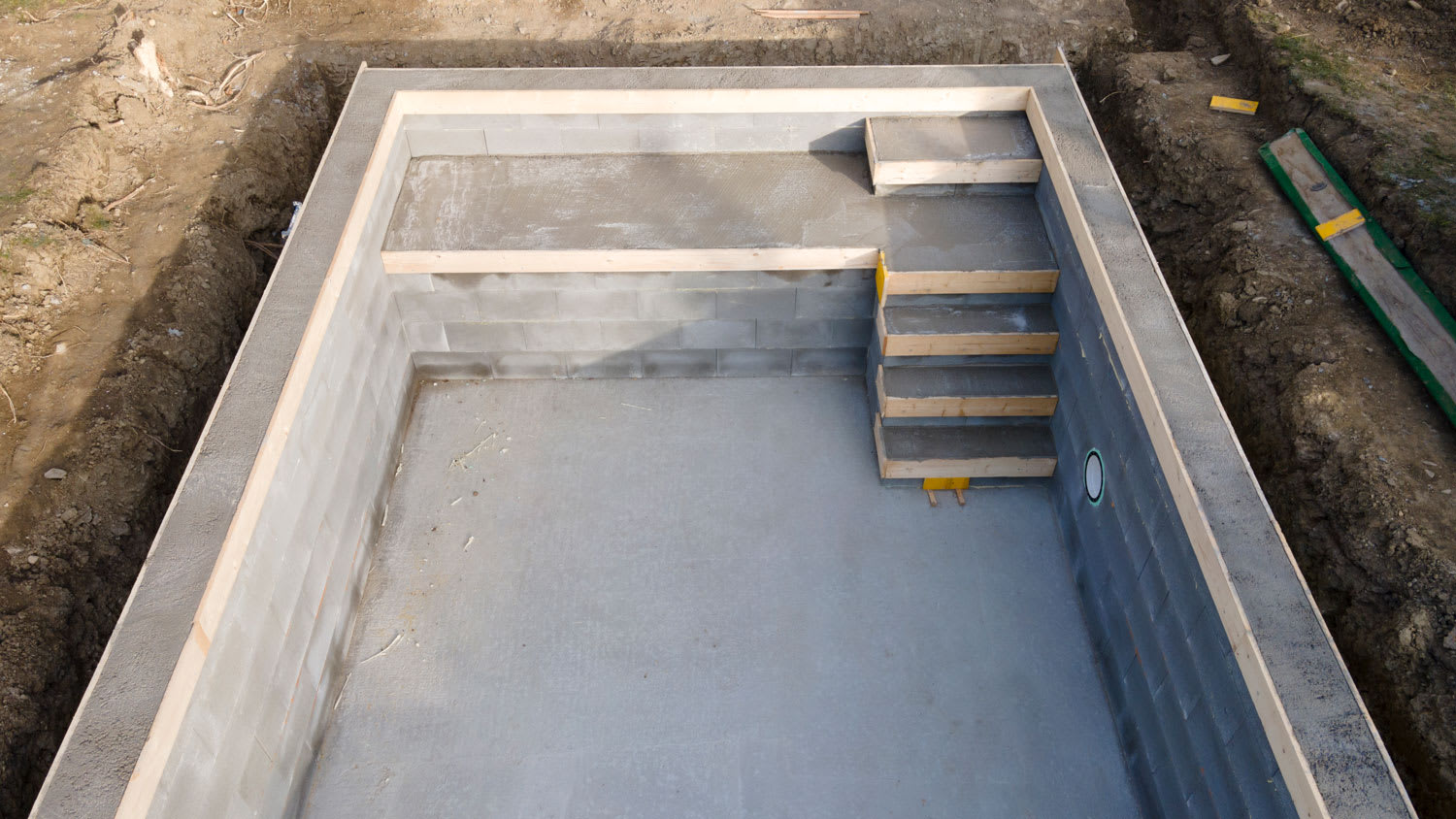 photo of pool construction site in a garden
