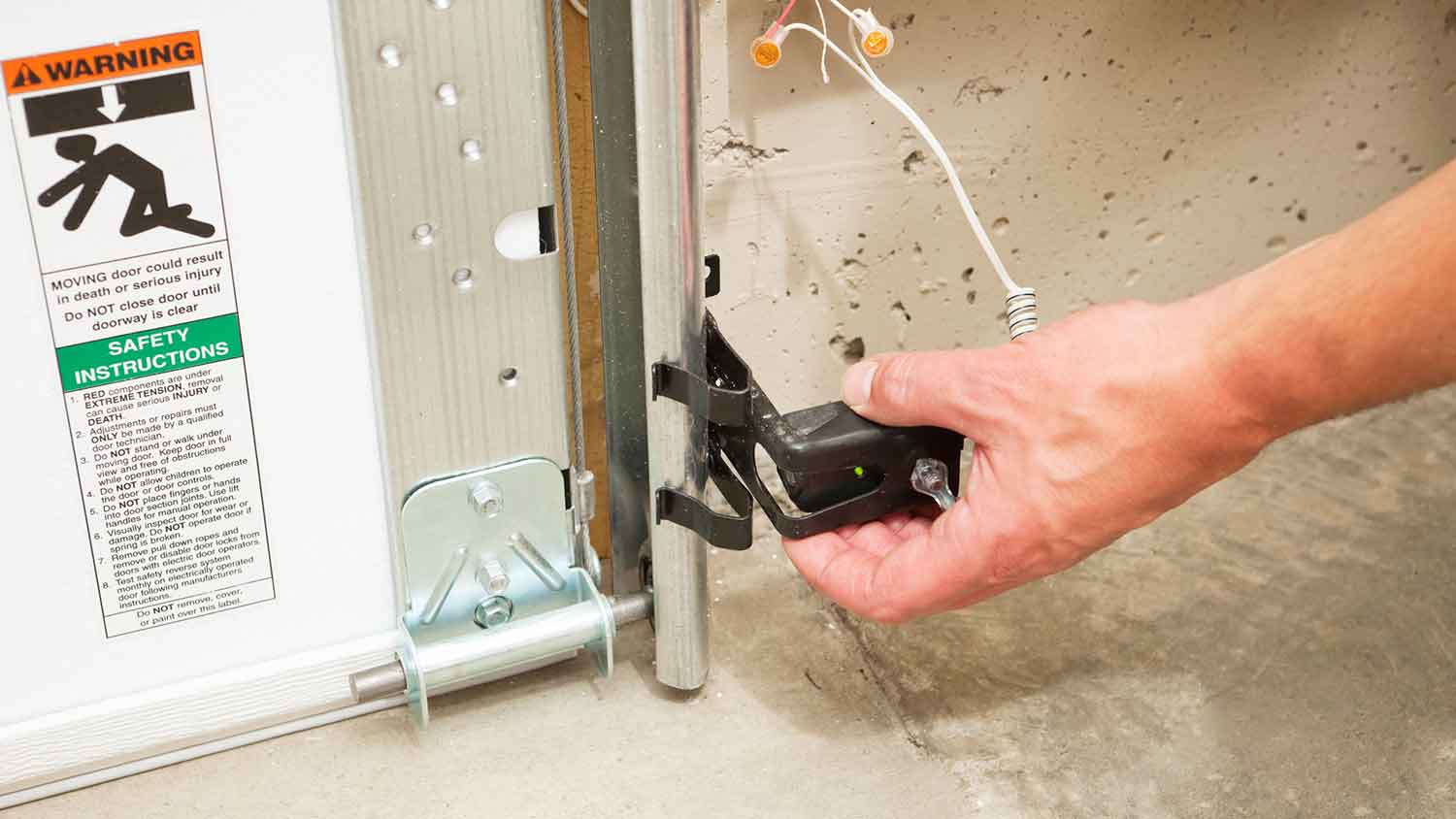 Adjusting garage door obstruction sensor