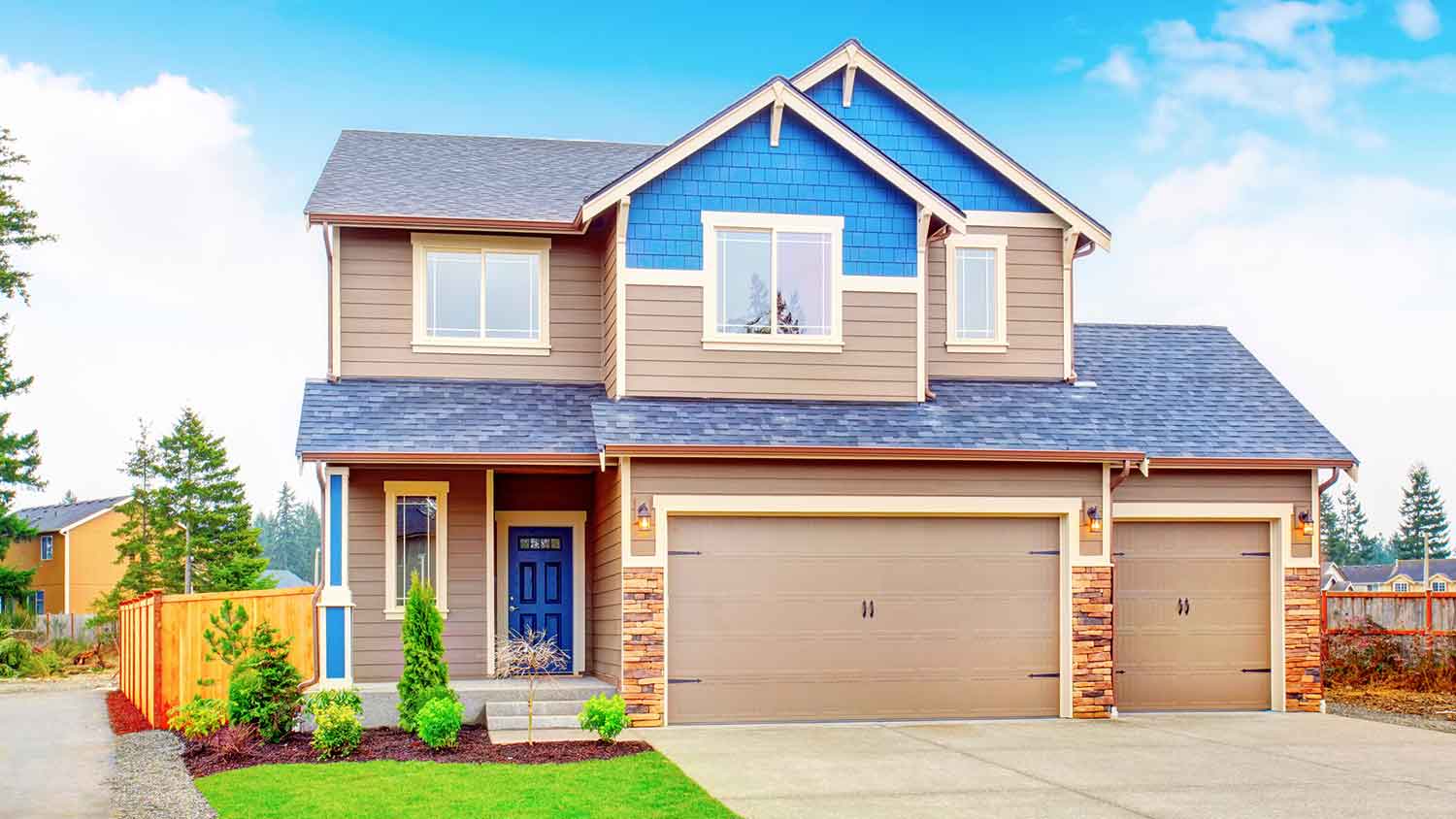 Suburban house with built in garage and brown siding