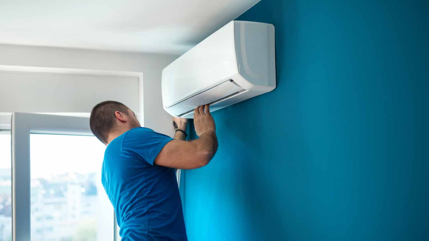 Man installing an AC unit