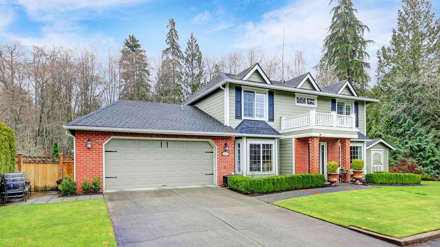 Country house with an attached garage and concrete driveway