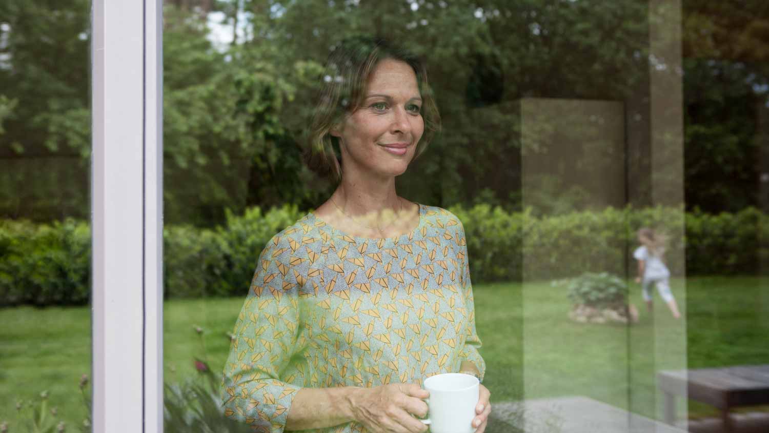 Woman looking out of window