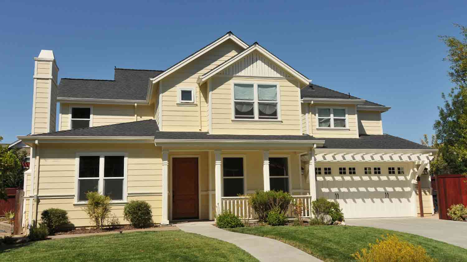 house with yellow vinyl siding