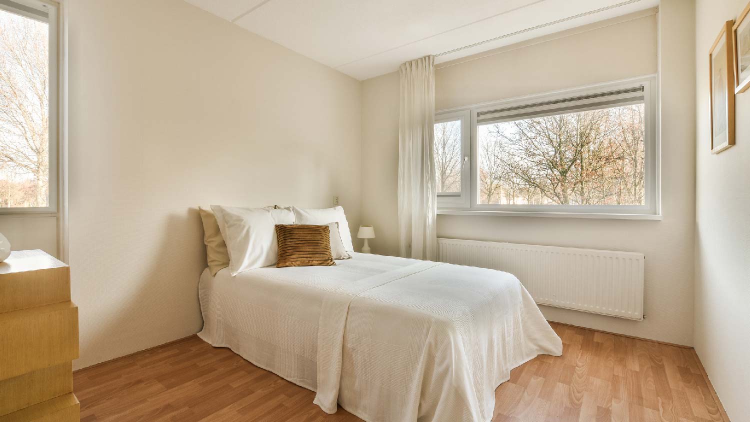 A bedroom with a large window