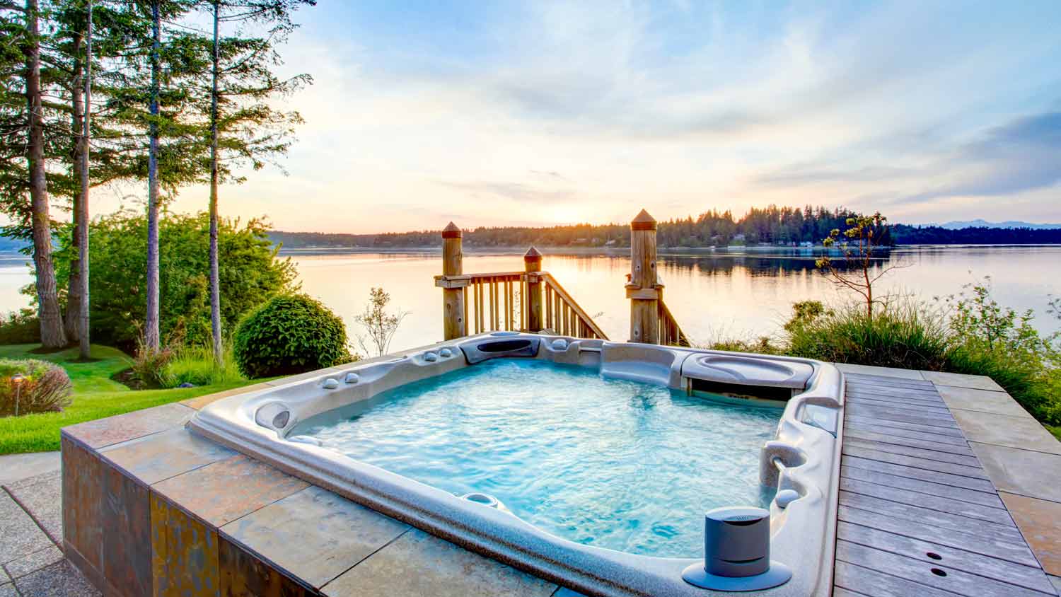 hot tub on deck during sunset