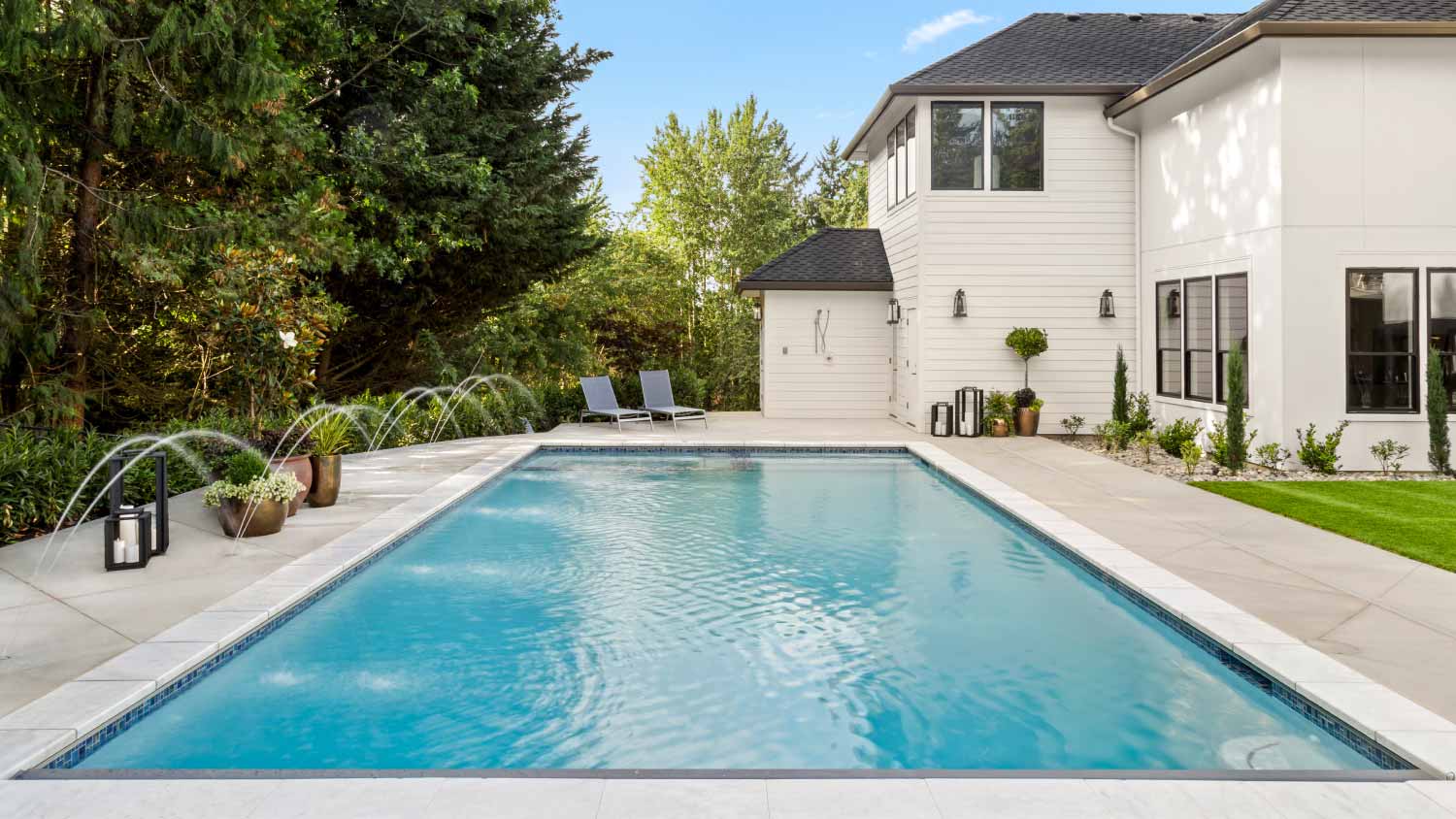 Home exterior and large swimming pool
