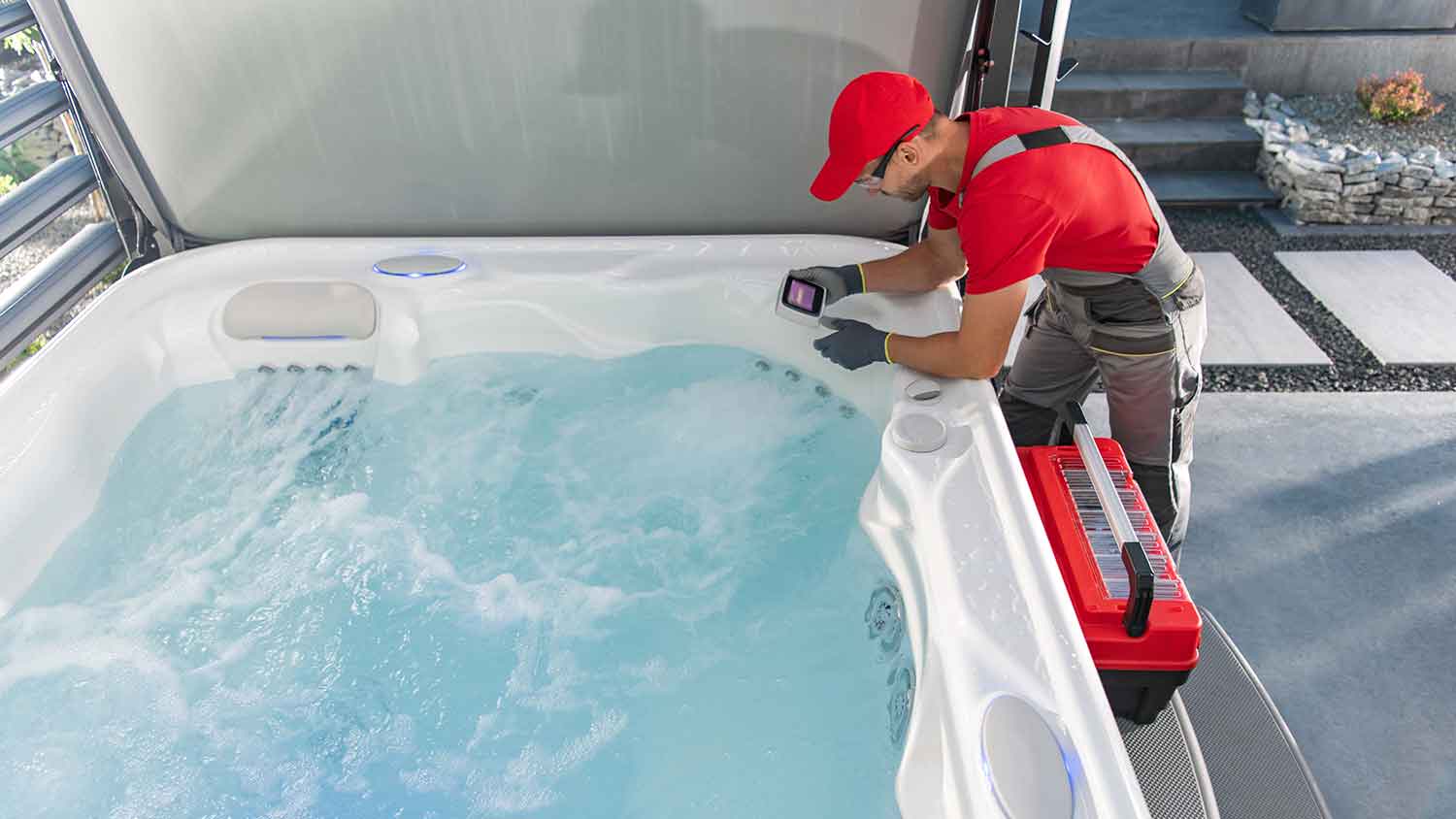 Technician checking hot tub control panel