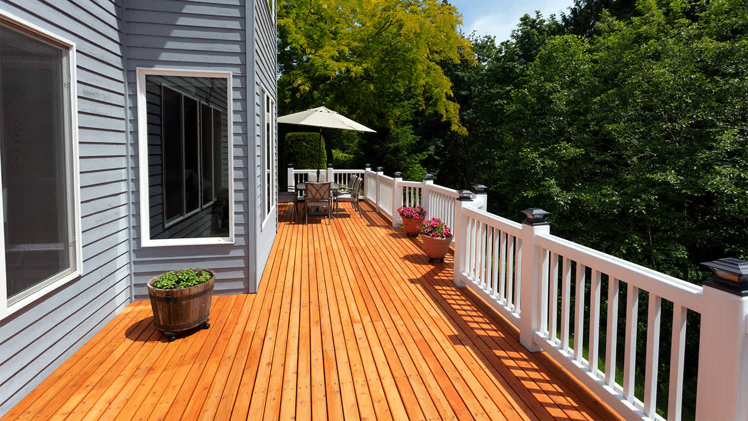 house with wood deck on sunny day