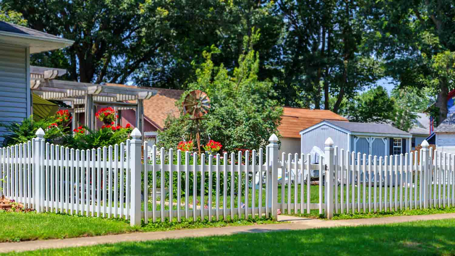 house with white vinyl picket fence