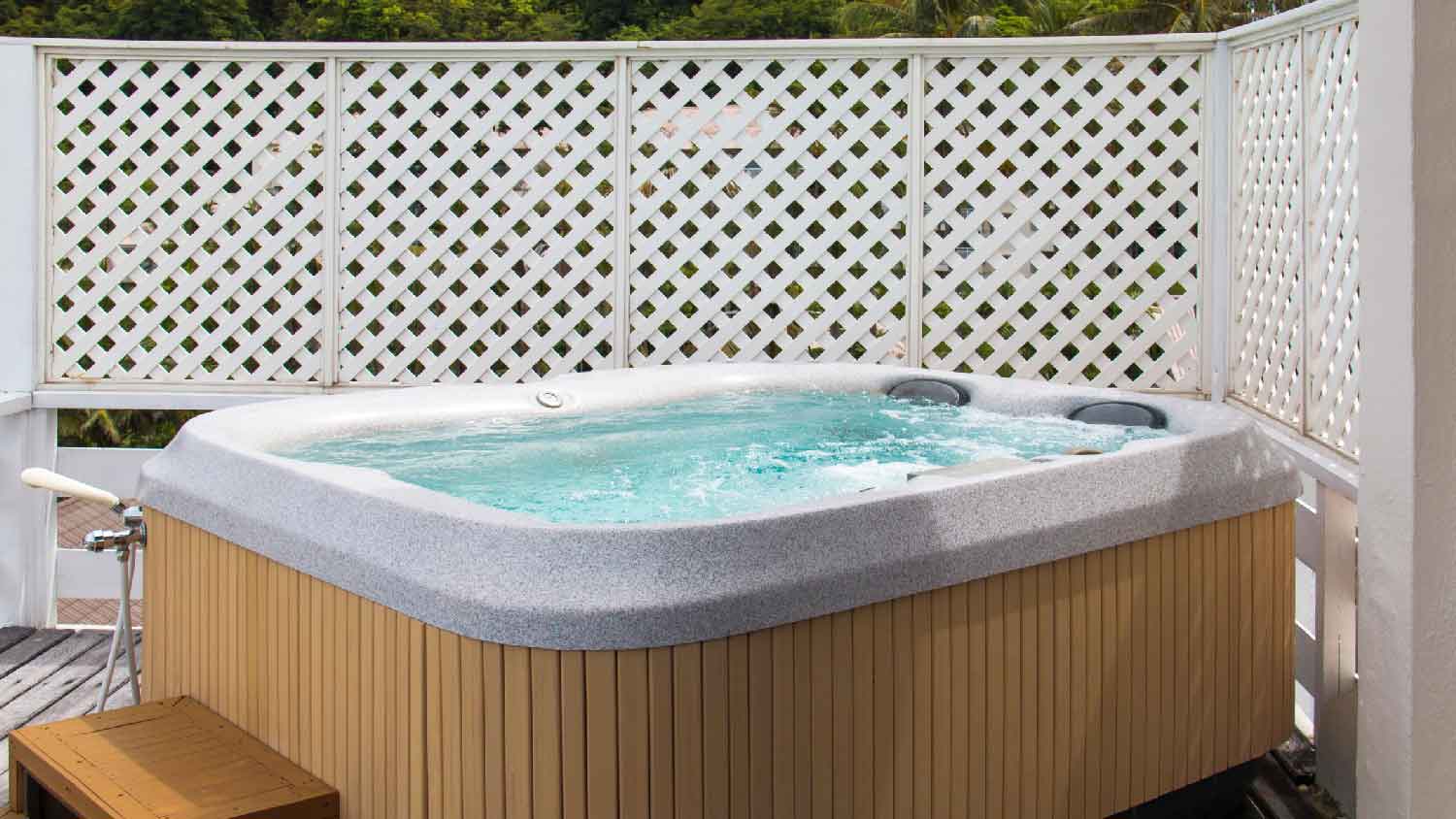 A hot tub on a wooden deck