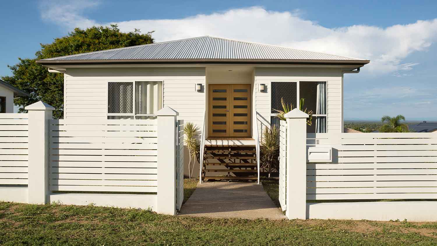 Contemporary house with metal fence