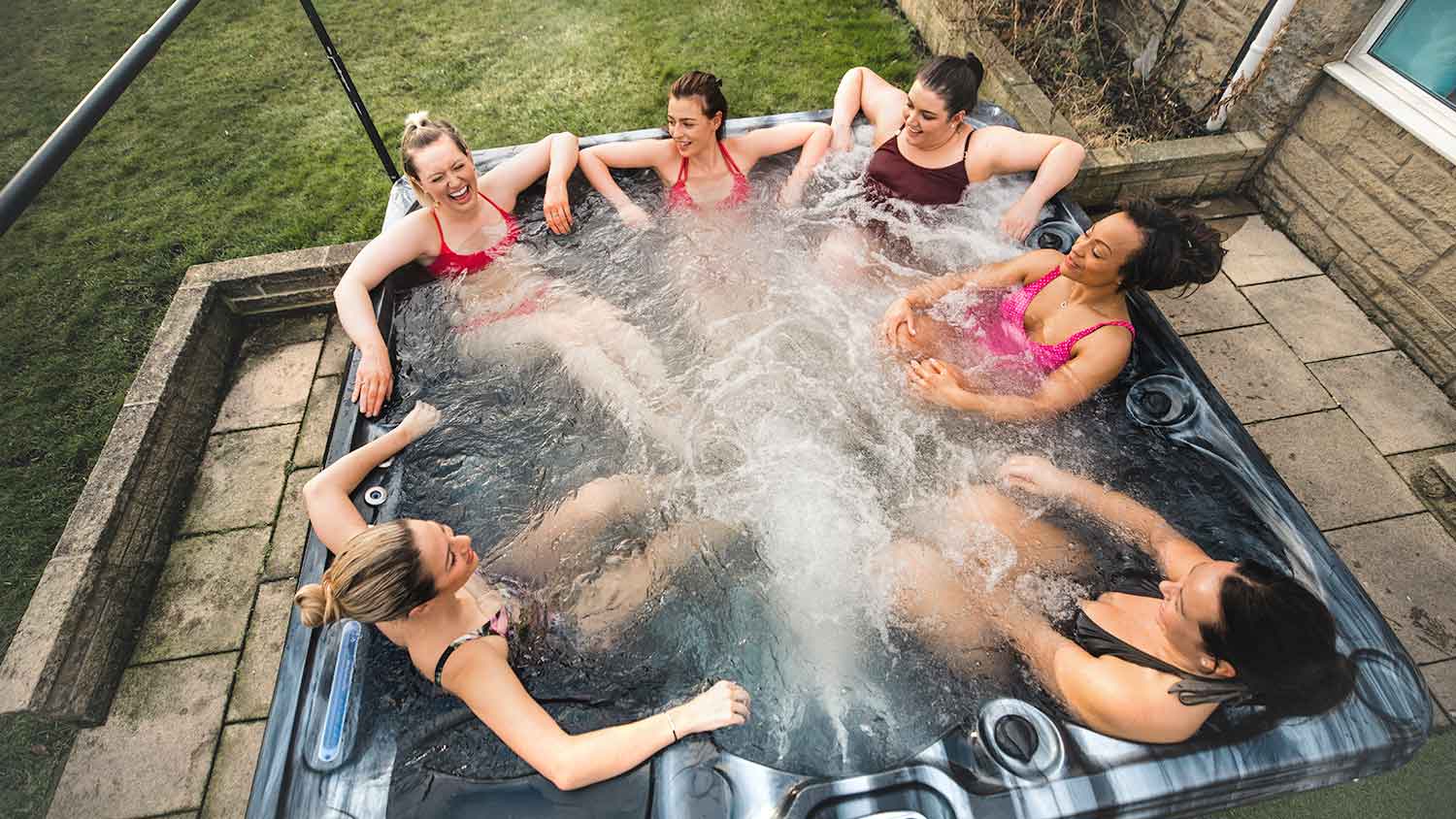 Group of friends enjoying time together in a hot tub