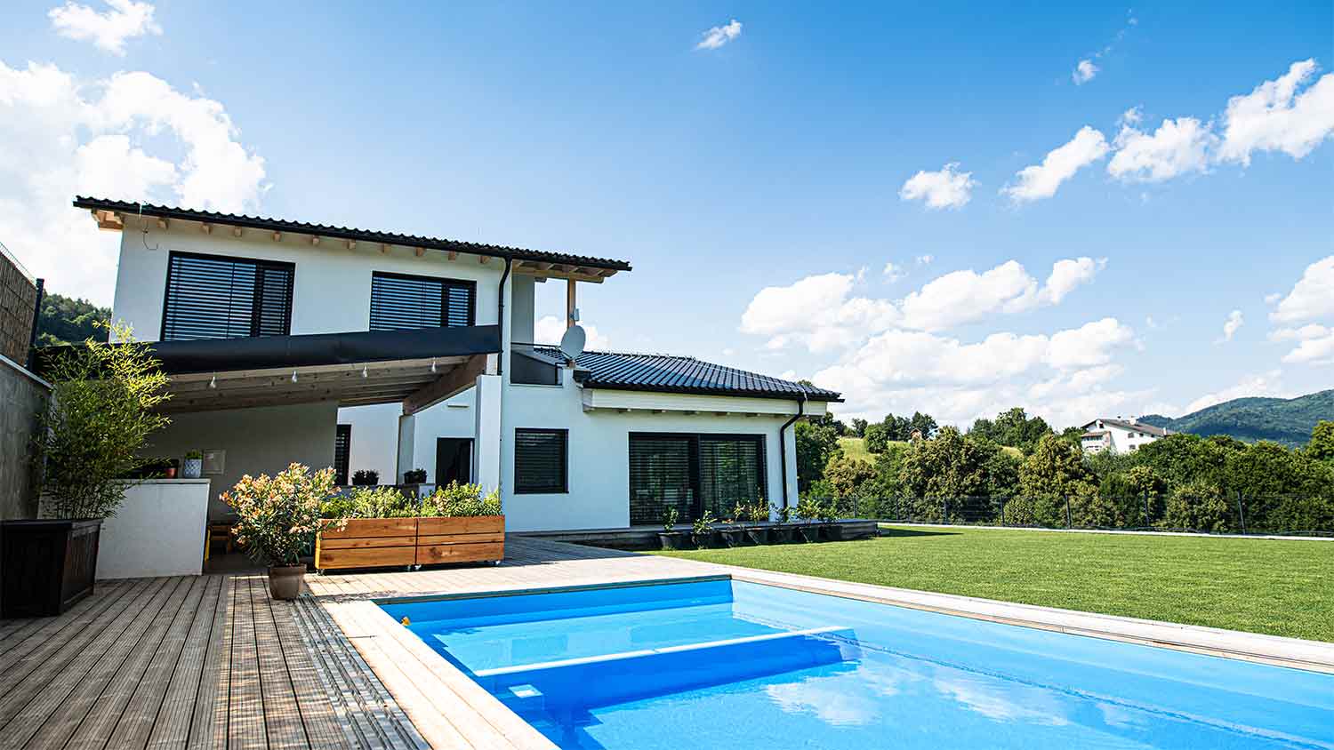house with large swimming pool in yard