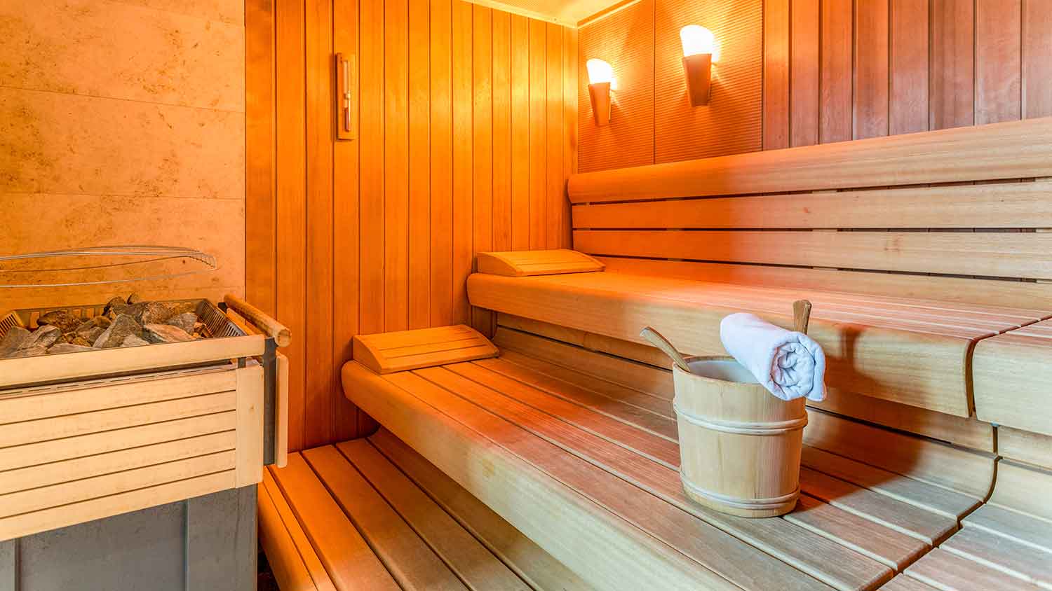 Traditional sauna room with electric heater