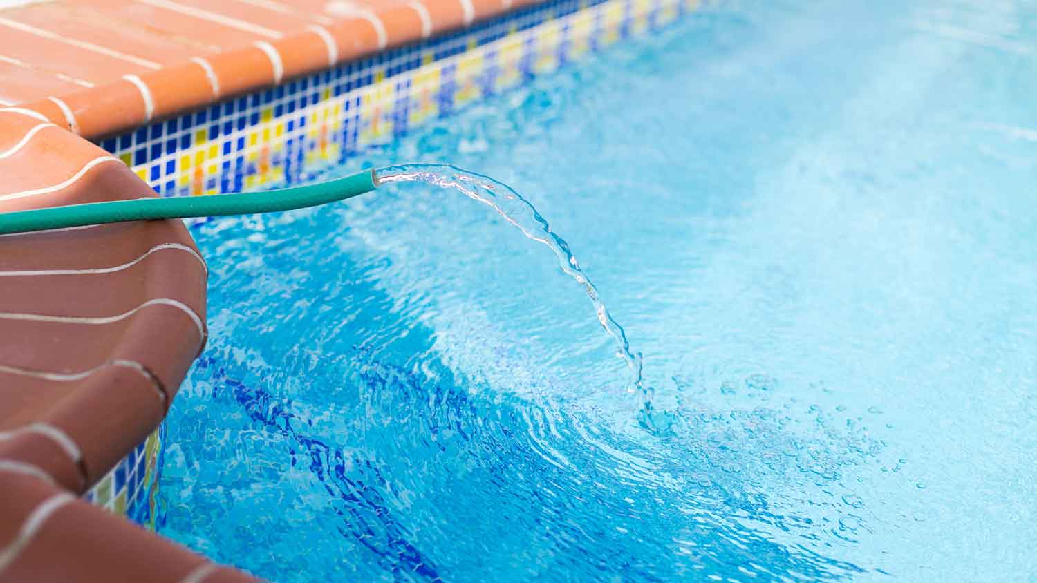 Using garden hose to fill swimming pool with water