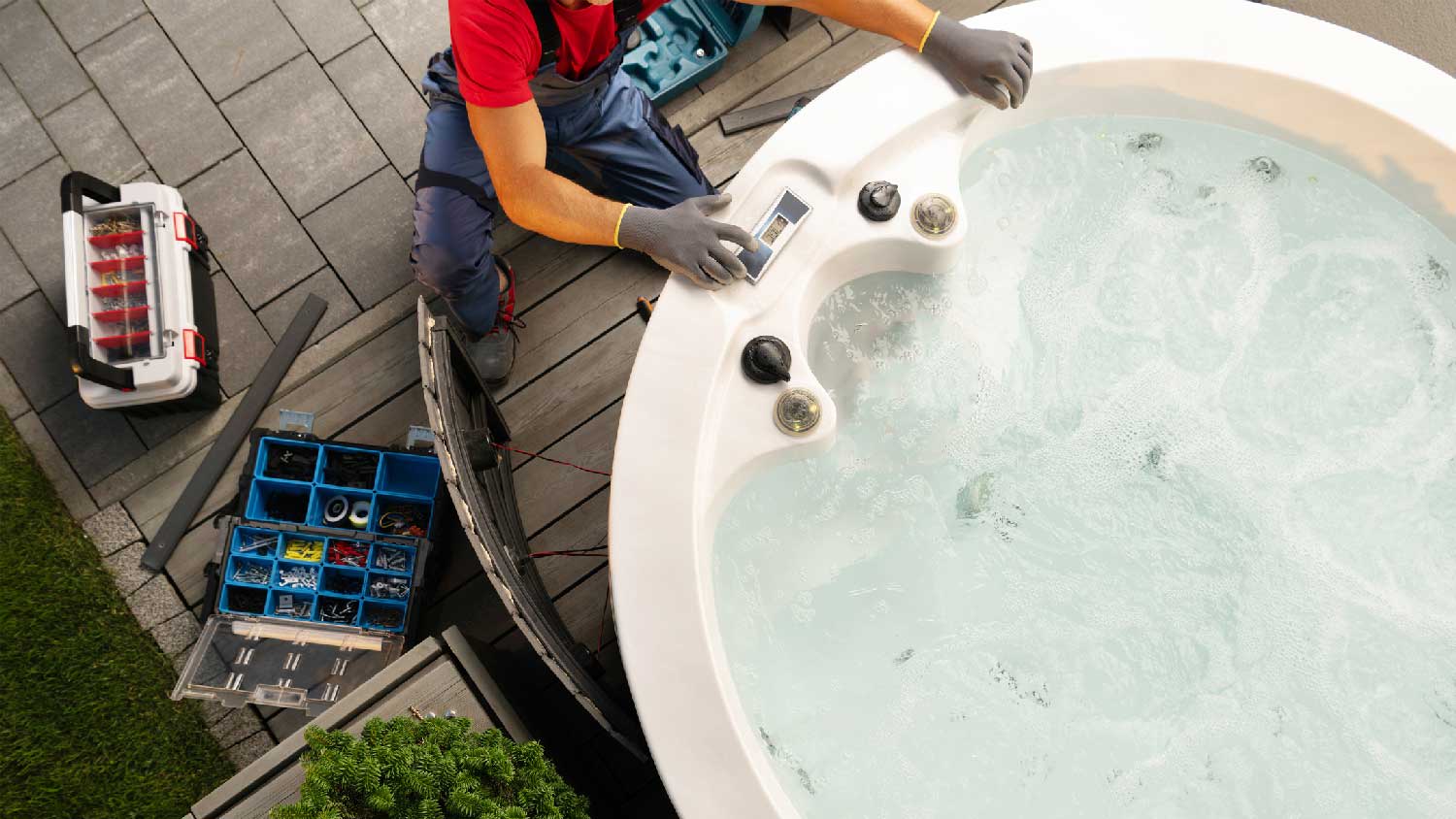 A man repairing a hot tub