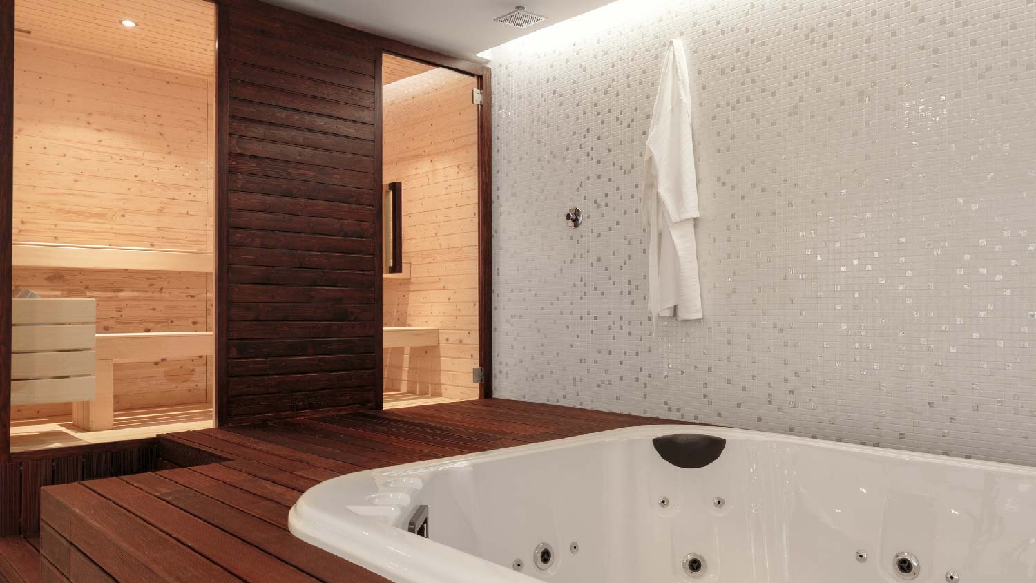 A sauna and a hot tub in the basement