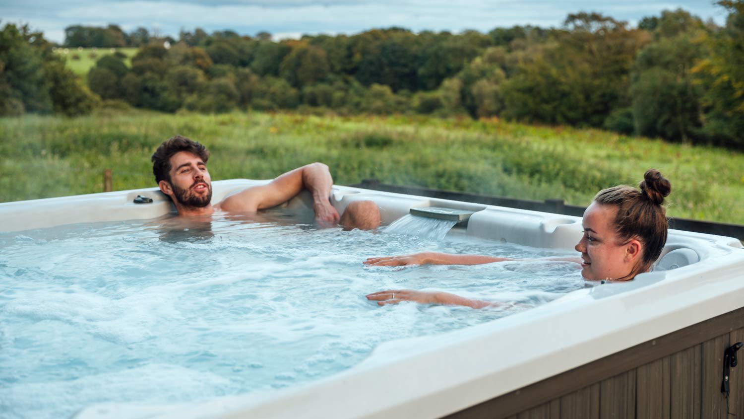 couple relaxing in hot tub