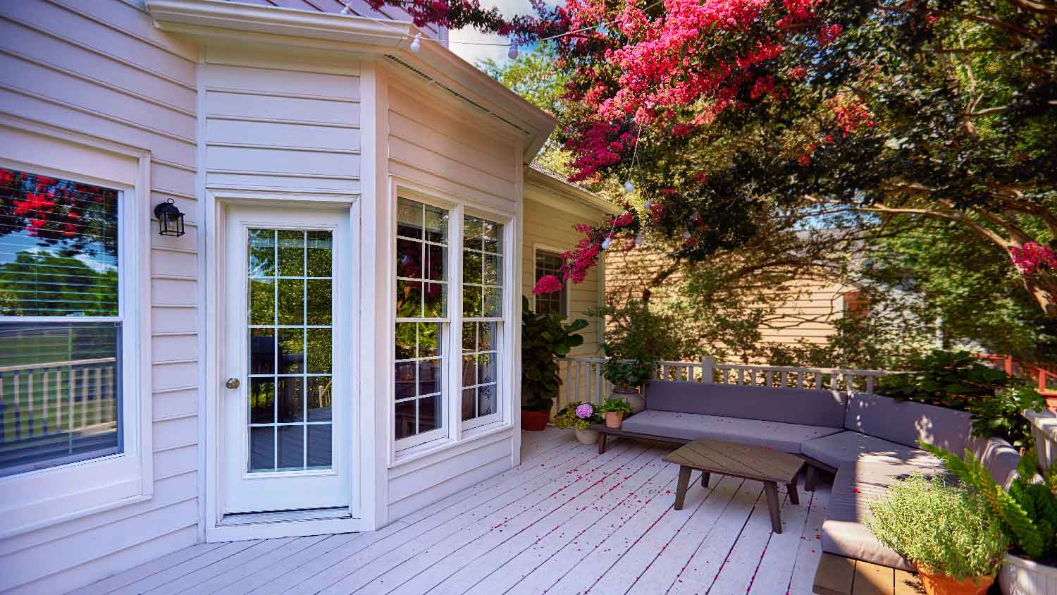 A beautiful terrace on a house with engineered wood siding