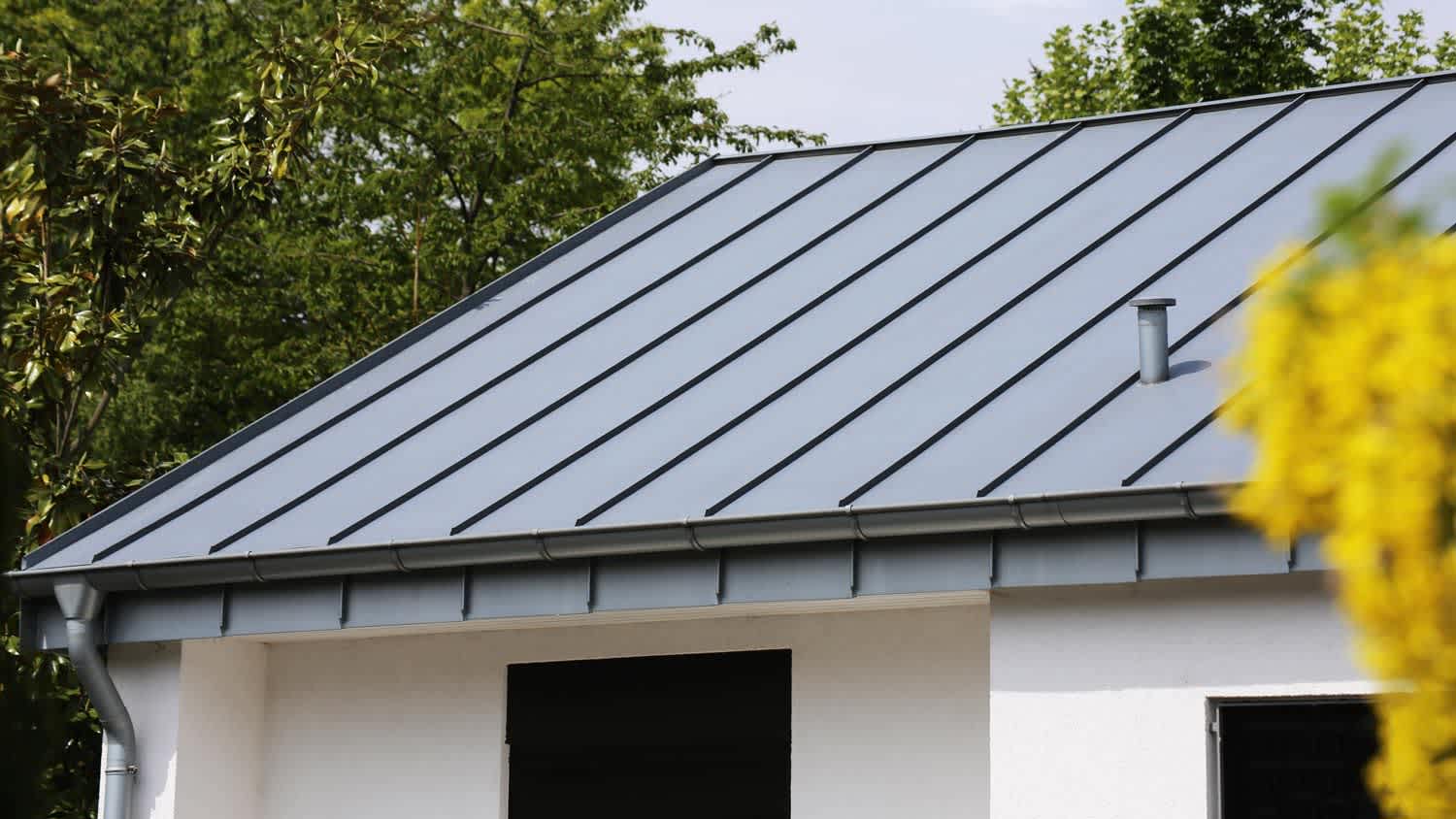 A house with a standing seam metal roof