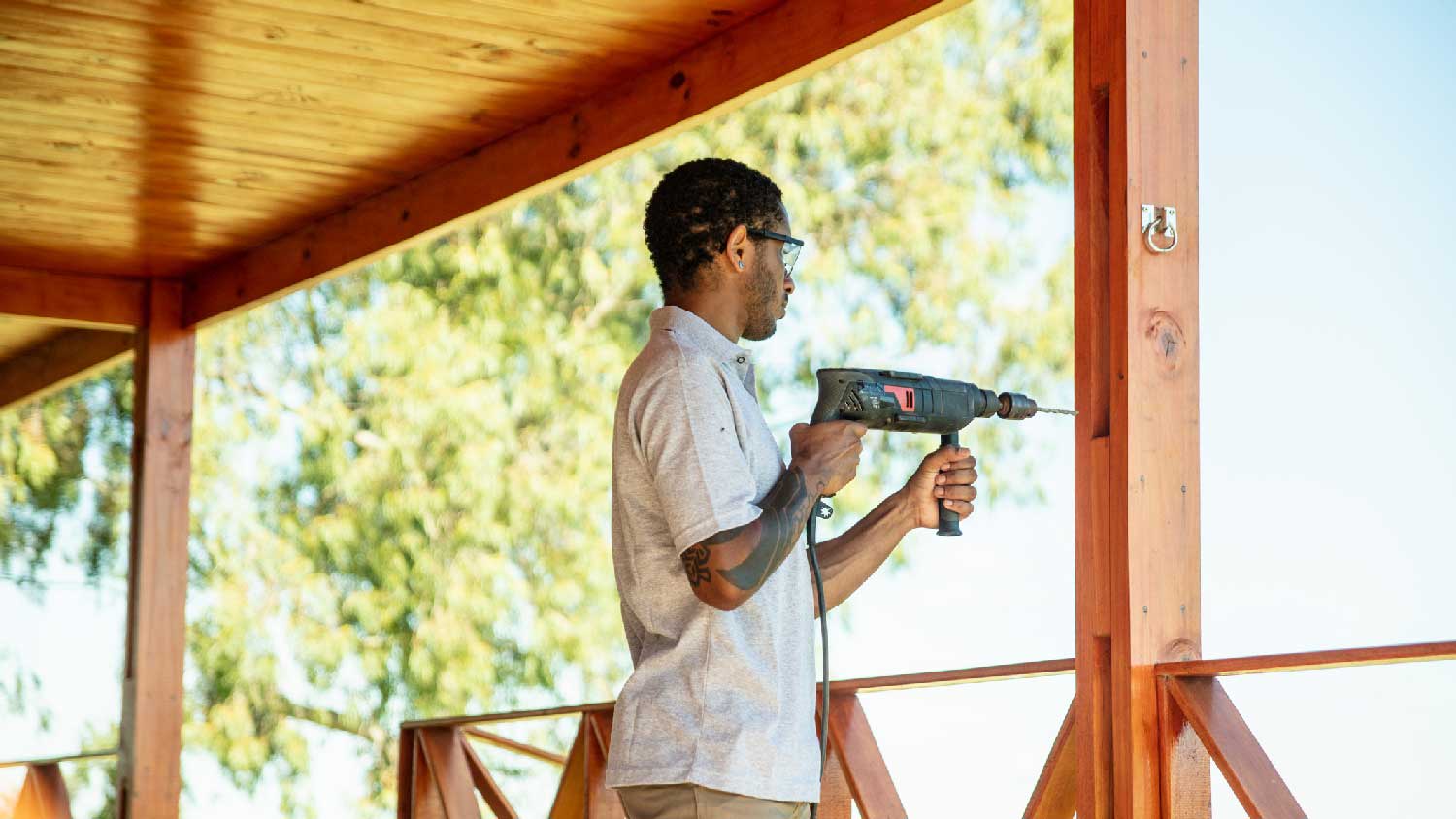 A man building a porch