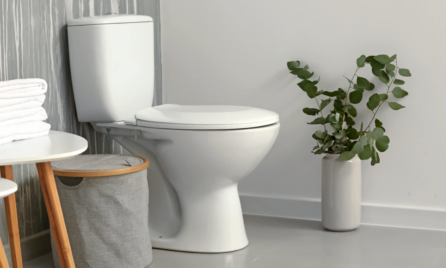 The interior of a bathroom with a ceramic toilet