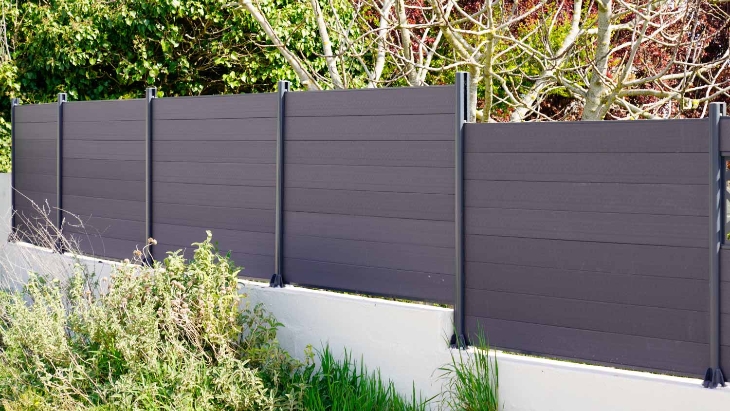 Gray wooden fence, including different tones of gray paint