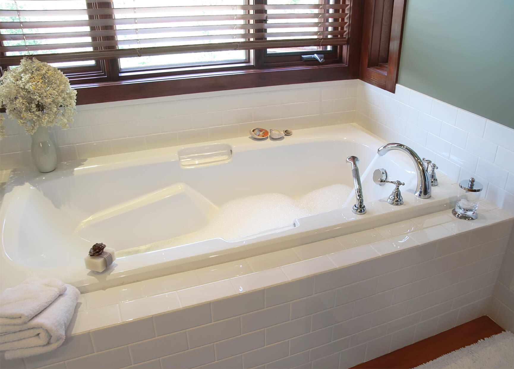 Modern spa bathroom with a black freestanding bathtub