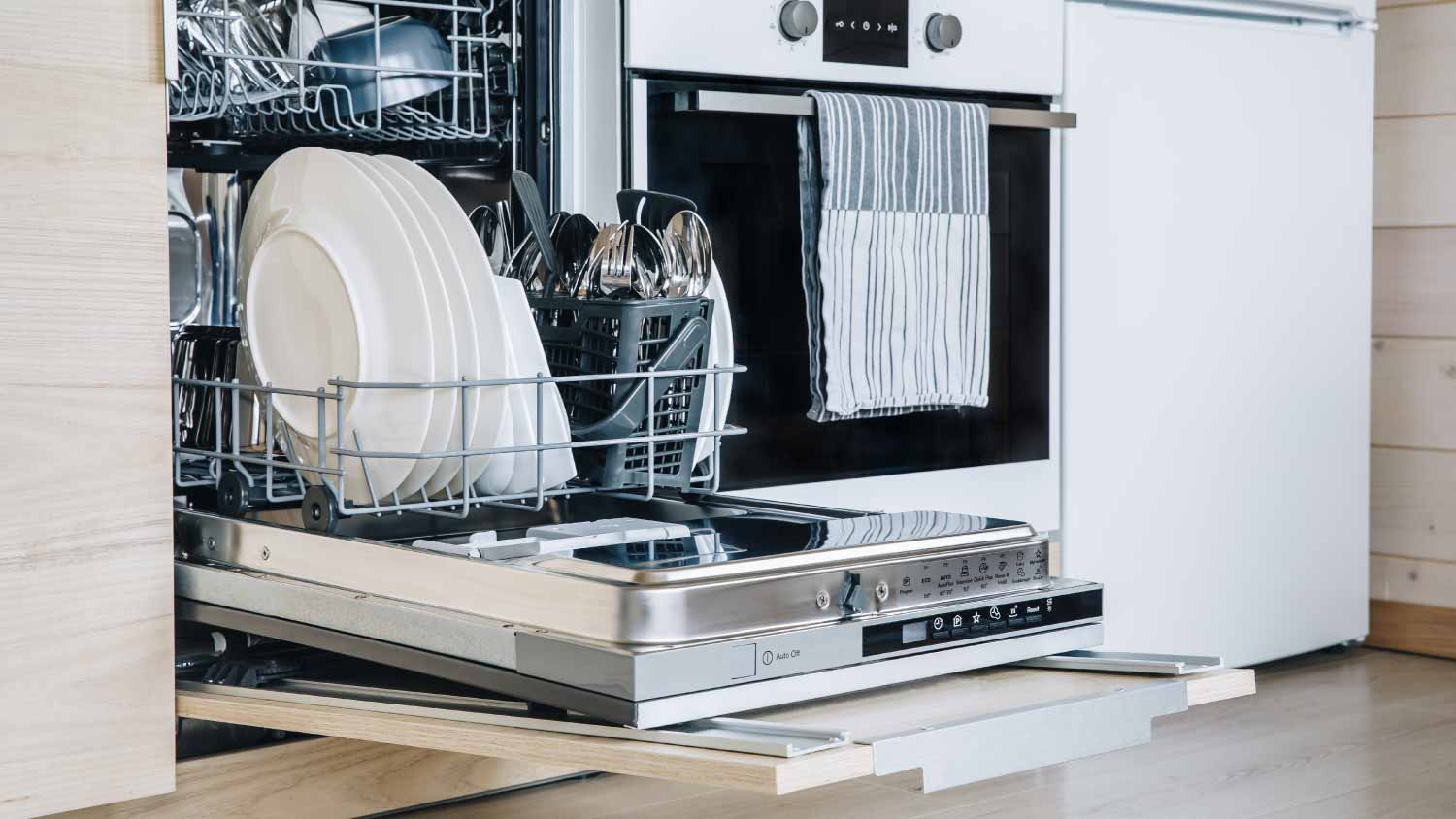 An open dishwasher in kitchen