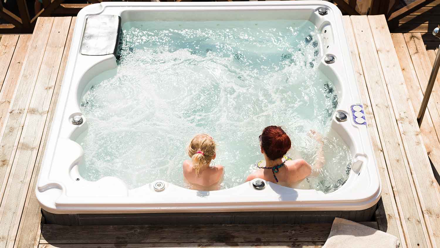 Mother and daughter relaxing in the hot tub