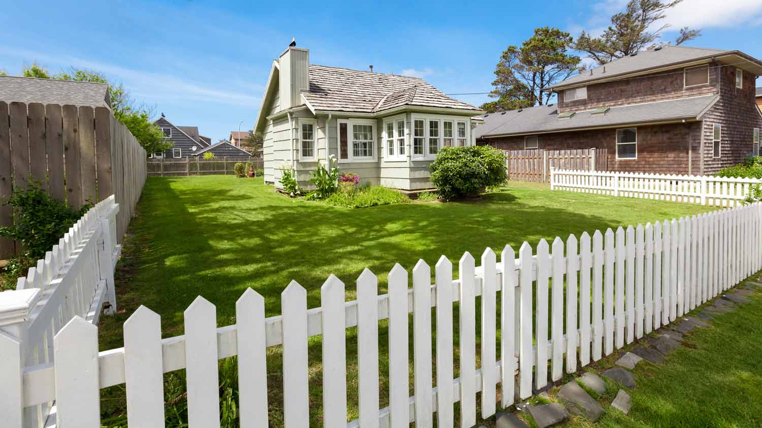 white fence all around house