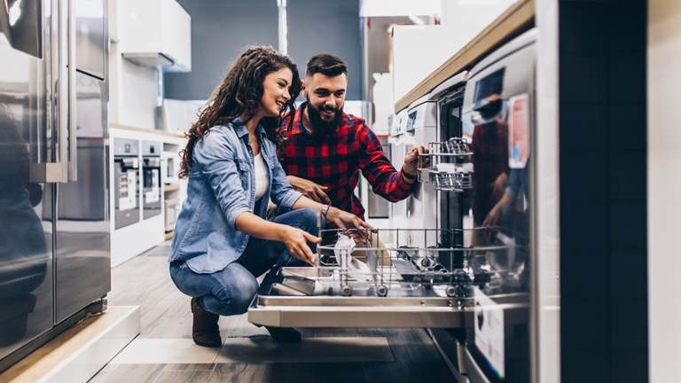 Couple shopping for kitchen appliances