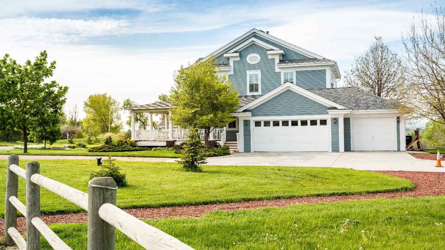 The exterior of a house with a large yard
