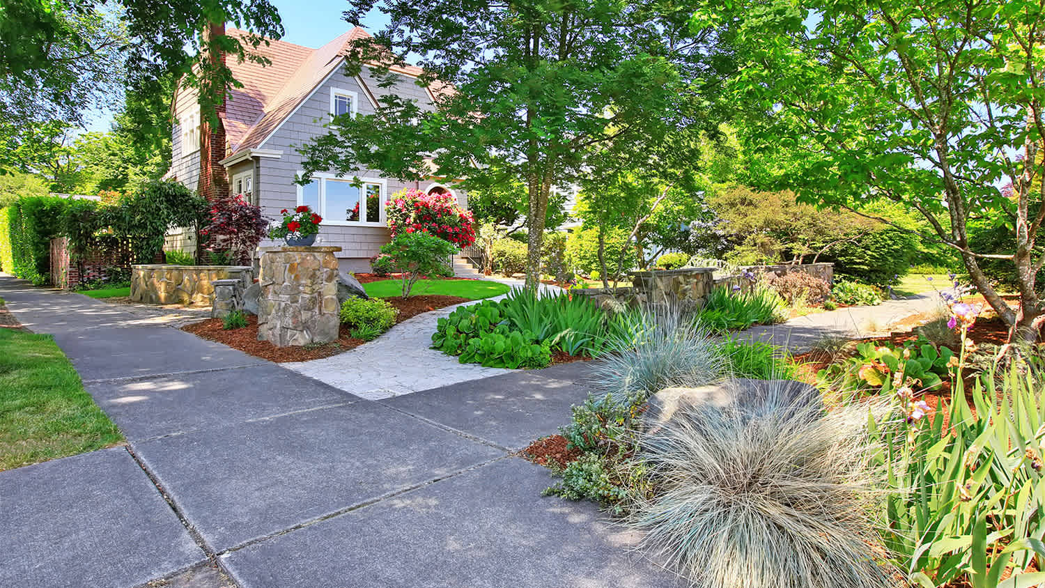 two level house exterior with parking slip garden