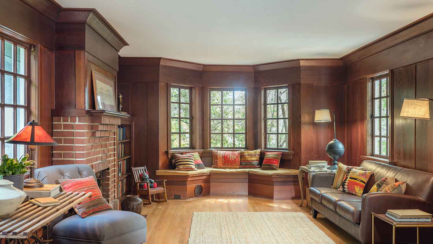 Living room with wood crown molding and wooden panels