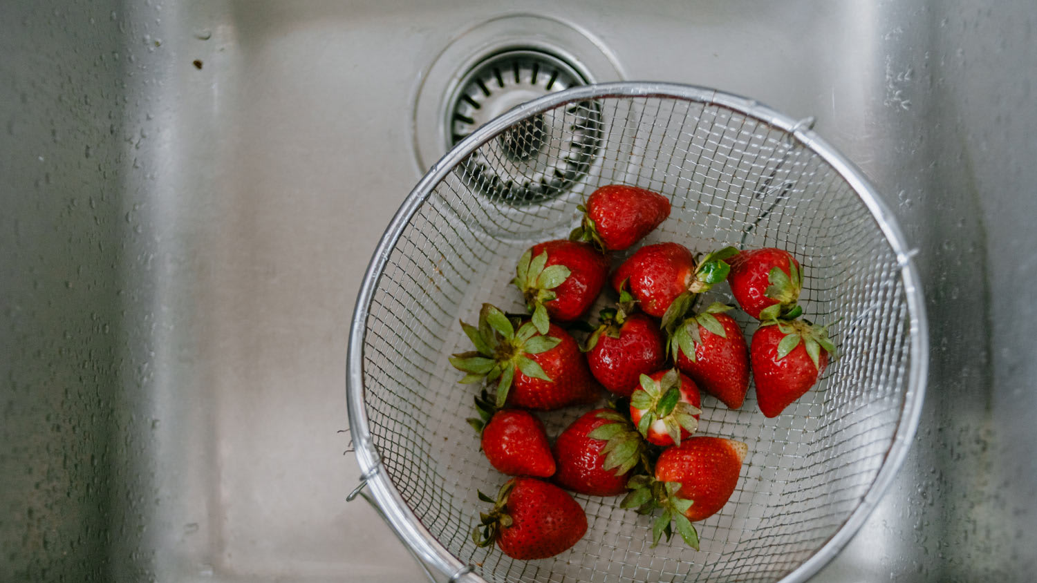 Strawberries in a kitchen sink