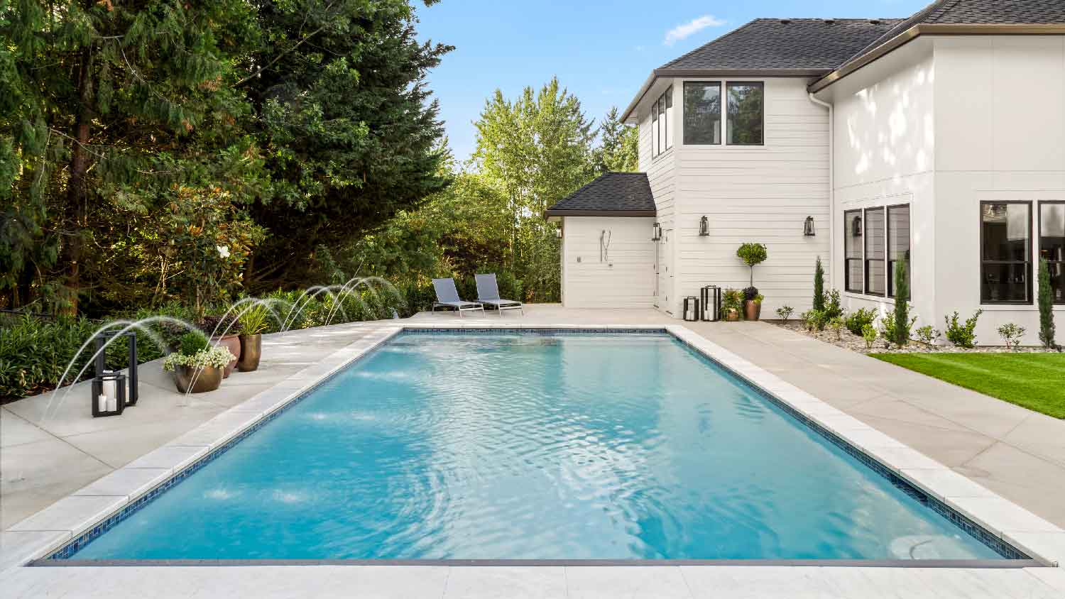 A pool in the backyard of a house
