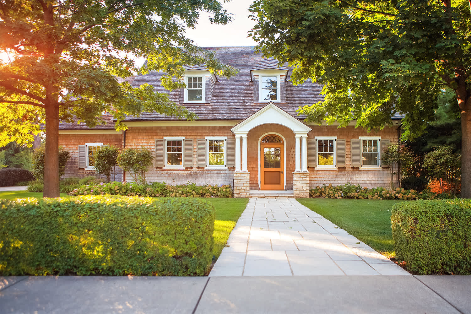 Family home exterior at sunset