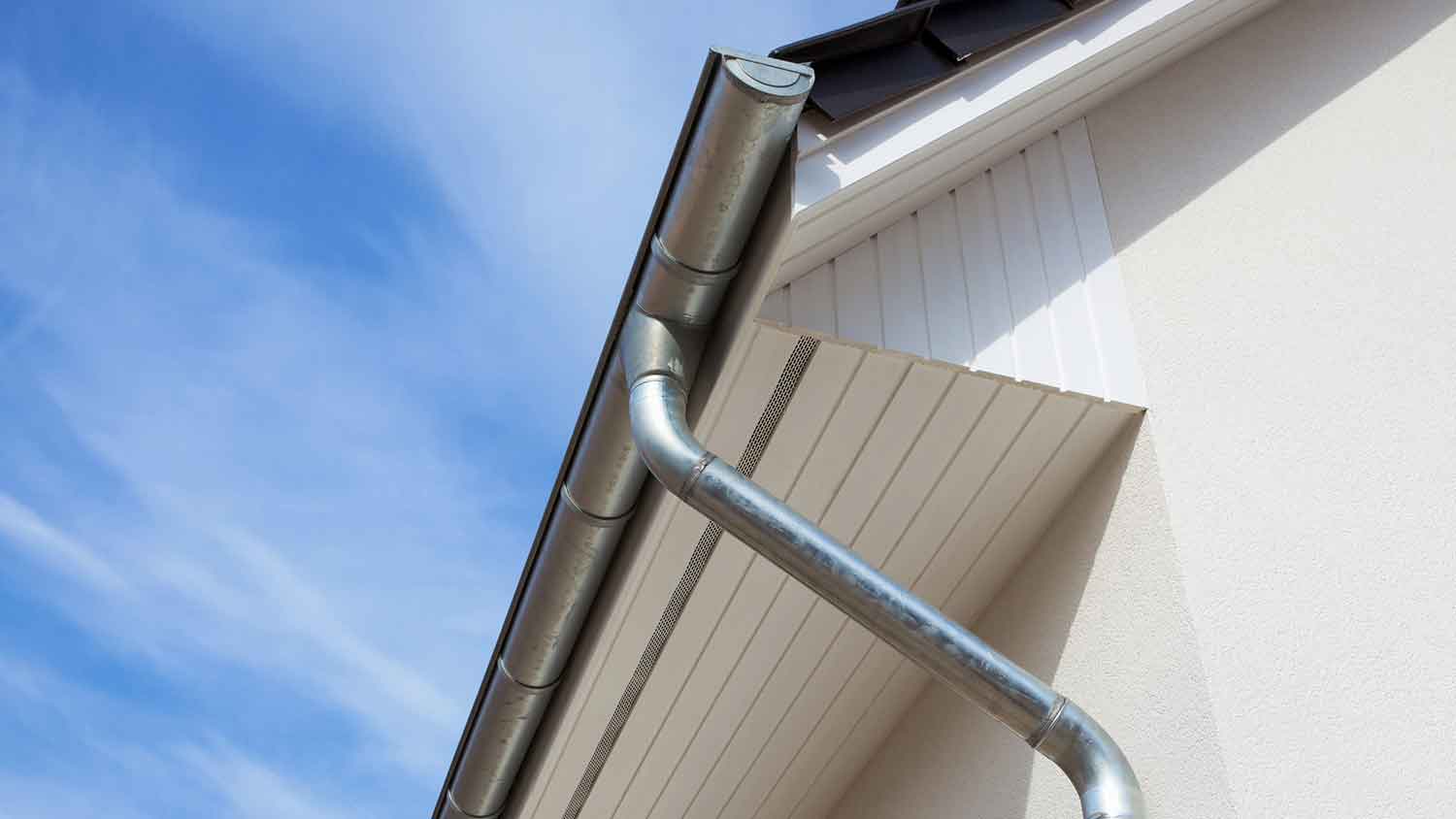 Zinc gutter installed on the roof of a house