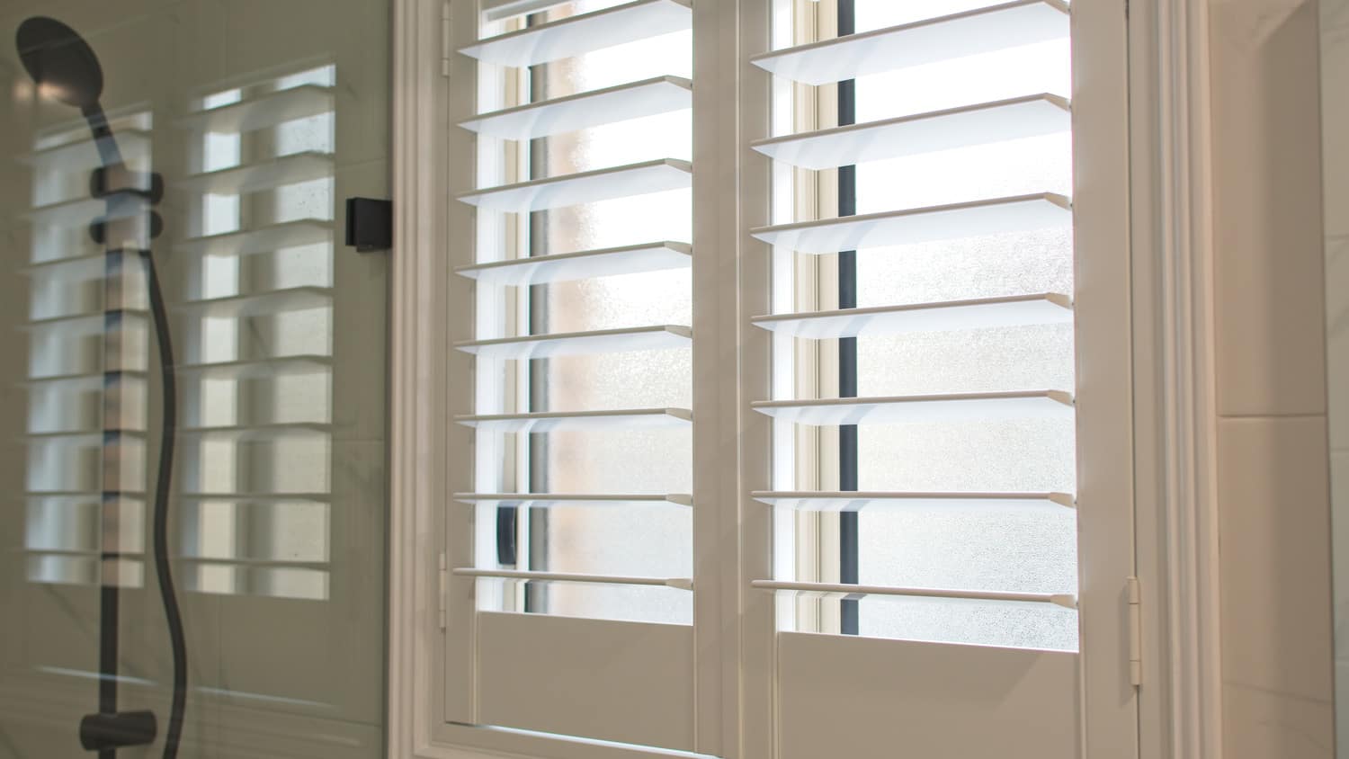 Luxurious plantation shutters in bathroom window