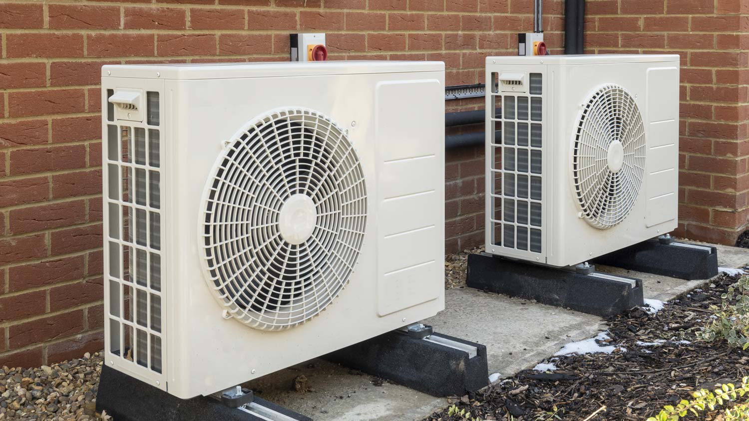 A heat pump system located outside a house