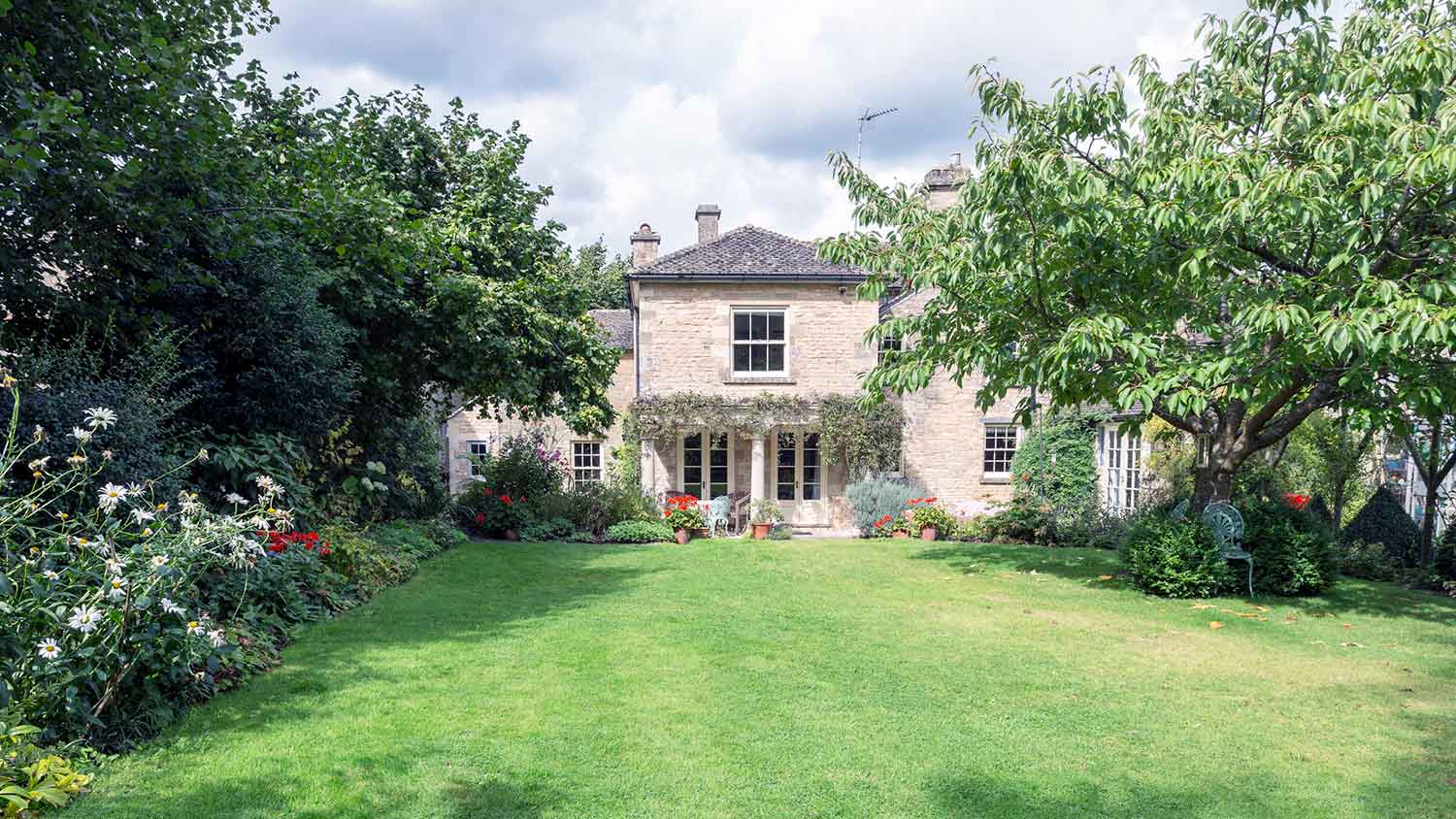 Country house with large yard and trees