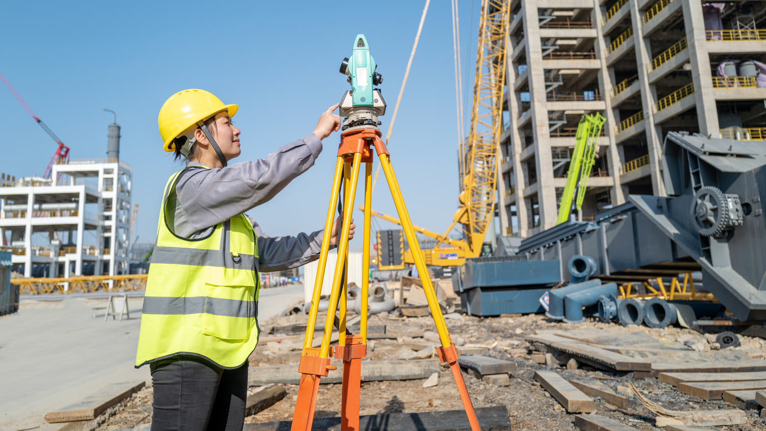 A female engineer measuring the construction site