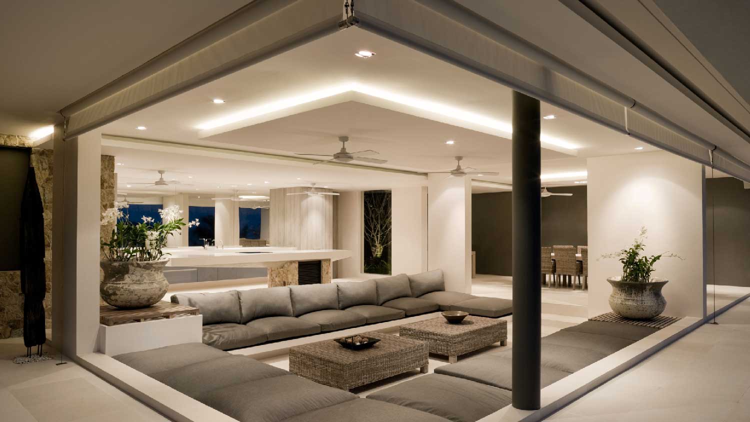 A minimalistic living room with recessed lights