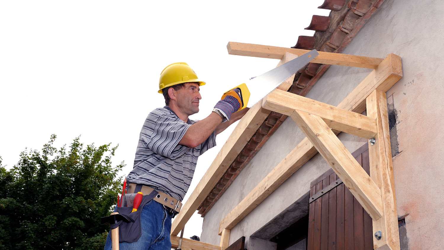 worker building wood awning