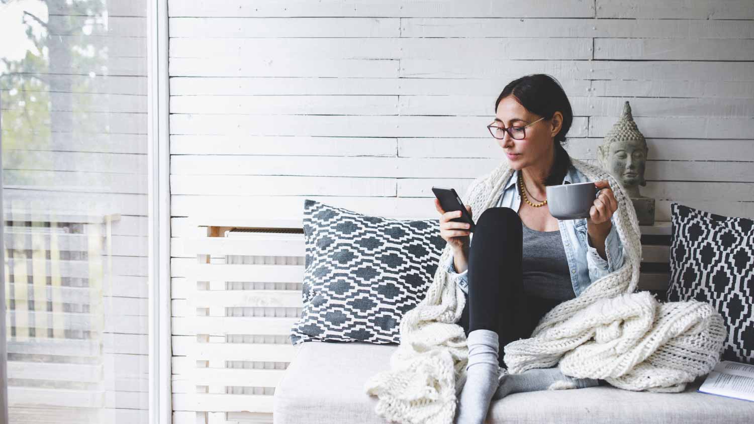 Woman sitting and drinking tea