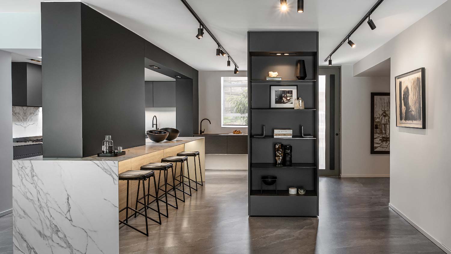 A sleek modern kitchen with track lighting